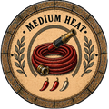 Decorative plate with a red hose, gold nozzles, and text 'Medium Heat' on a wooden background.